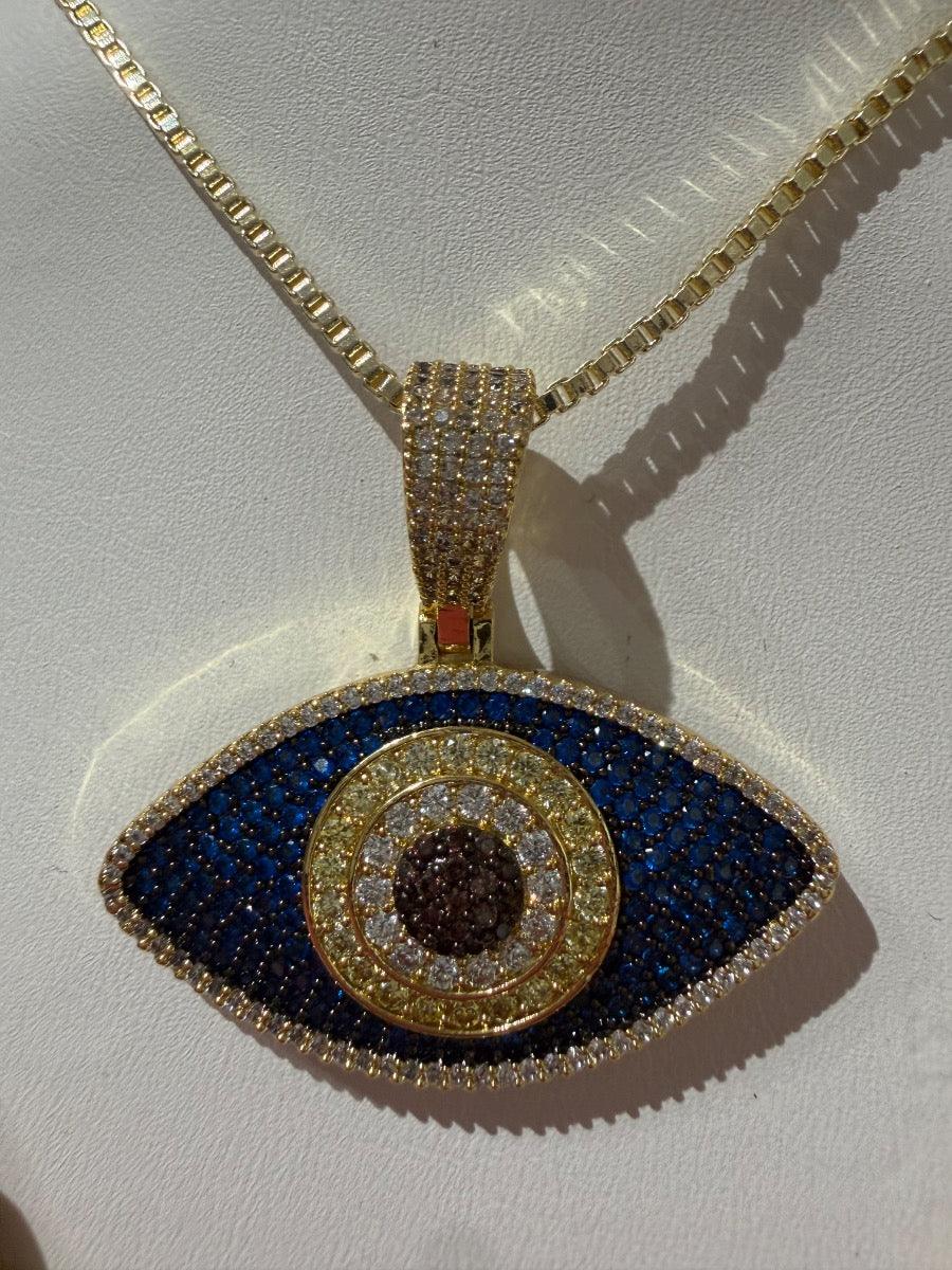 Collar de oro con dije de ojo turco azul y circonias brillantes, joyería elegante.